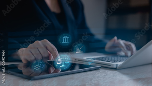 Quadro su tela Business professional using digital interface with AI governance, legal compliance and policy management icons, representing responsible artificial intelligence,transparency and regulatory oversight