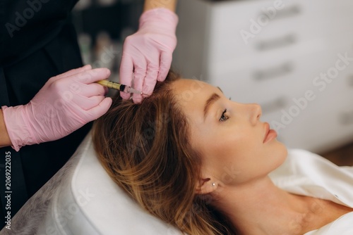 Konstfotografi Woman receiving mesotherapy scalp treatment for hair growth