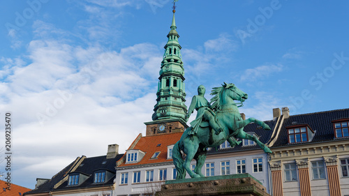Photography Absalon equestrian statue facing nikolaj church tower in copenhagen