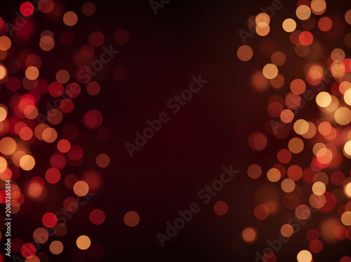 Abstract warm red and orange bokeh lights on dark background