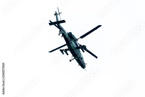 Close-up of helicopter flying away on isolated white background