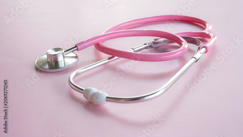 Pink stethoscope close up shot on pink background for medical and healthcare concept