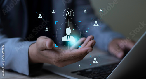 Fotografie Businessman showing open hand with virtual AI recruitment target focus ring and candidate profiles on laptop