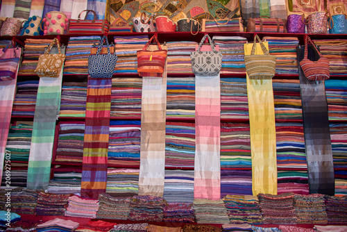 Bild auf Leinwand A local bazaar displays traditional leather crafts and textiles typical of Maghr