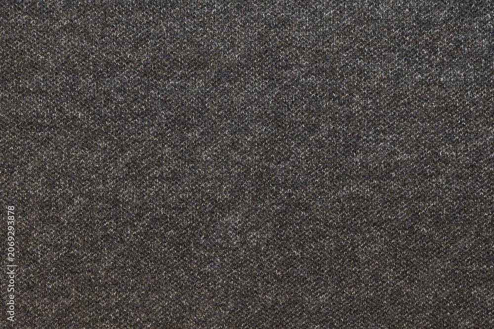 Fototapeta premium Closeup charcoal ribbed knit fabric showing soft stretch yarn, subtle vertical ribs, neutral palette suitable for minimalist wardrobe pieces, knitwear designer sample for slow fashion brands