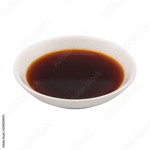 Small white bowl with soy sauce, a common Asian condiment, isolated on transparent background