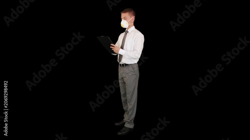 Young businessman, protective glasses and mask, taking notes, Luma Matte