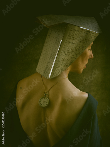 artistic portrait of a woman with a paper hat made of calendars VI