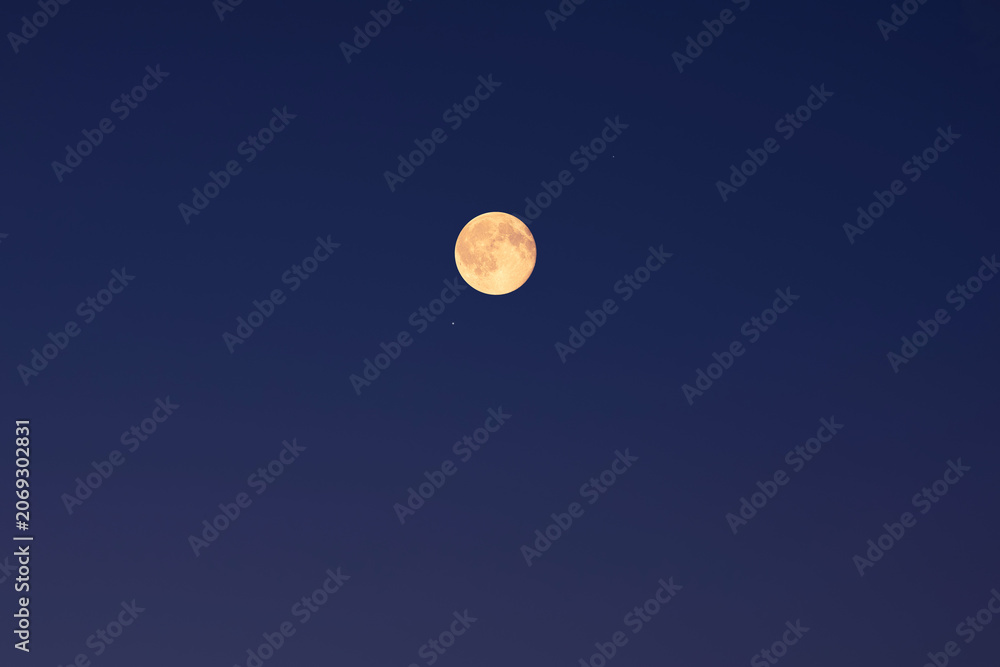 Fototapeta premium Full Moon on a twilight background.