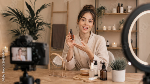 Beauty creator demonstrating skincare application on camera, useful for influencer marketing, product tutorials, and lifestyle beauty content.