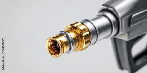 Close up of a metallic fuel nozzle with intricate detailing and shiny finish