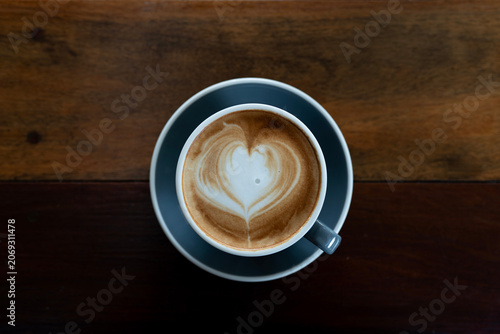 cappuccino on dark old grunge wooden table top view