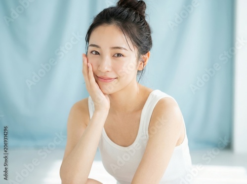 A Beautiful Young Asian Woman With Natural Makeup And Radiant Clear Skin
