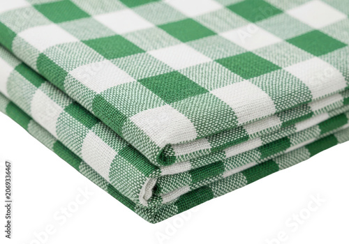Folded green and white checkered tablecloth isolated on transparent background