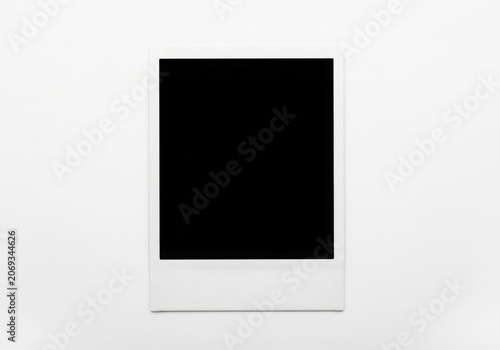 A Blank Polaroid Photo On A White Background