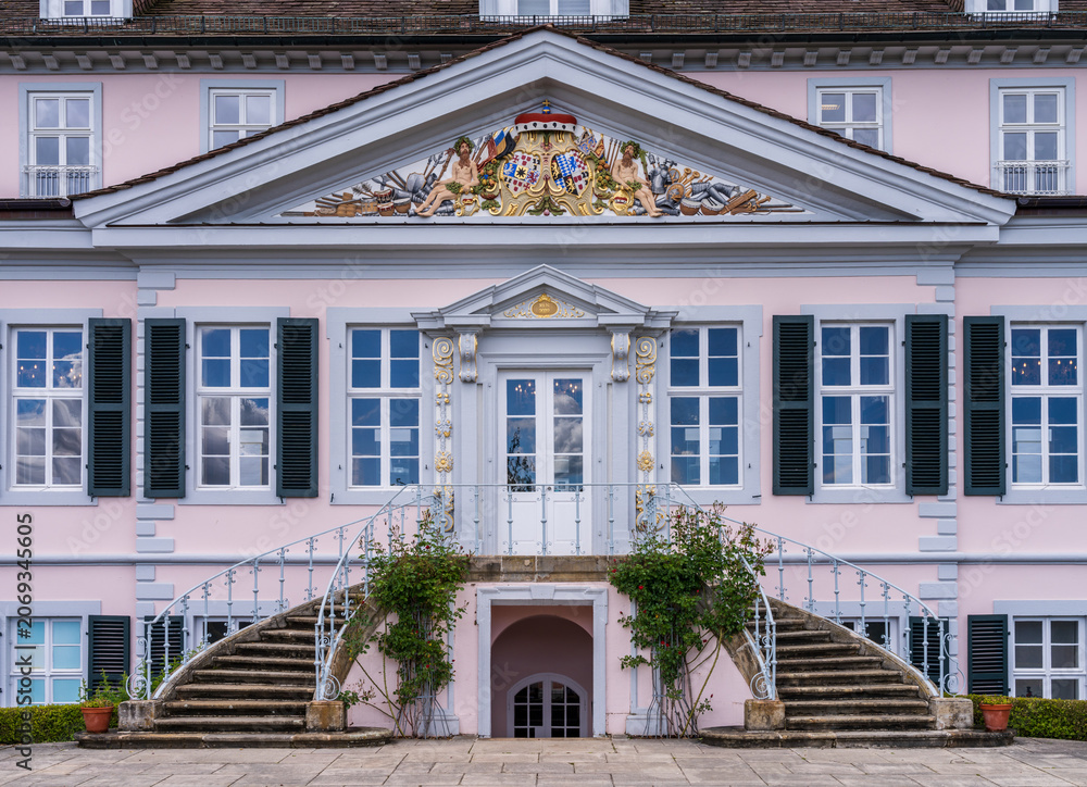 Fototapeta premium Historic Schloss Pyrmont in Bad Pyrmont, Germany, featuring classic architectural details under a cloudy sky.