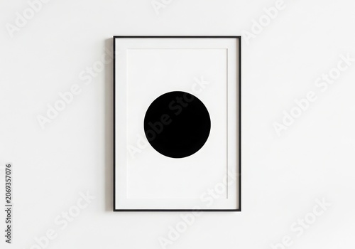 A Black Circle in a White Framed Picture