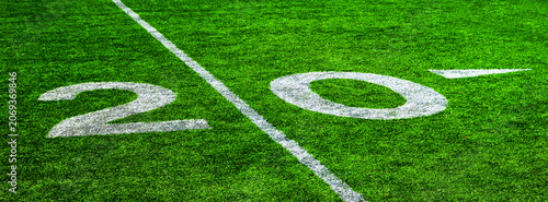 фотографія Football Field with Yardage Markers on Turf for Competition and Entertainment