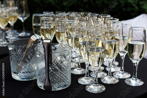 Champagne Glasses and Sparkling Wine Served at Elegant Celebration Event