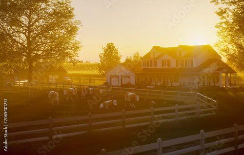 Sunlit farmhouse with barn and fenced countryside at sunset