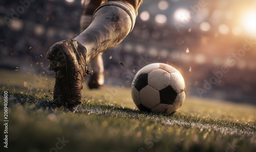 Close-up action shot of soccer player dribbling ball on grass pitch with football competition professional movement training exercise sunlight lighting tournament