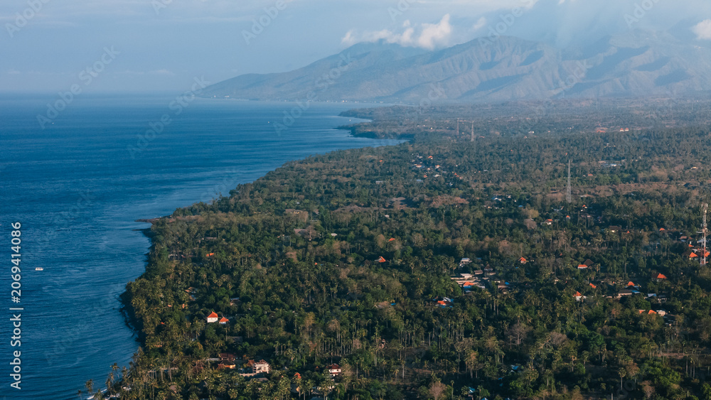 Fototapeta premium Above view of coastline with ocean in North Bali