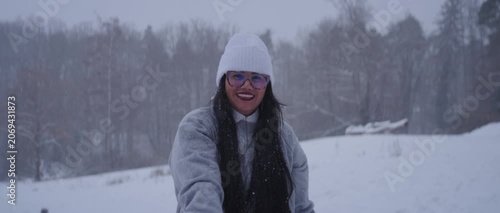 Happy Latina Woman from Colombia Enjoying Snow in Germany During Winter