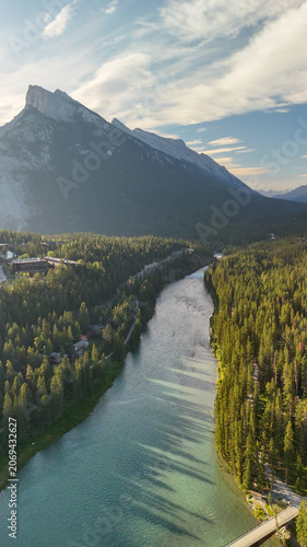 Panoramic aerial shot of Banff National Park with lush green valley in summer