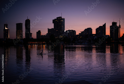 Canvas Print Vienna, Austria: City skyline at sunset at the Danube river