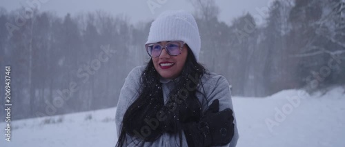 Happy Latina Woman from Colombia Enjoying Snow in Germany During Winter