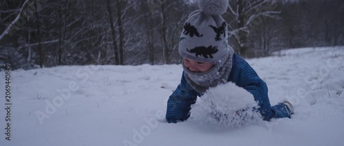 Happy Latina Mother with Baby Enjoying Snow in Germany During Winter