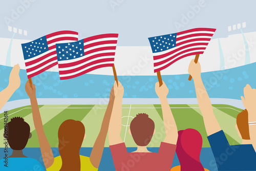 Fans wave American flags during a soccer match at a stadium with excitement and energy in the crowd while supporting their team