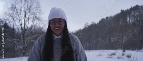 Happy Latina Woman from Colombia Enjoying Snow in Germany During Winter