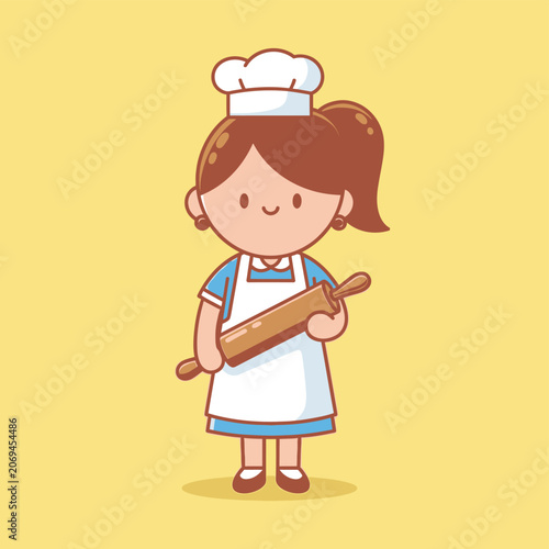 Little girl in chef hat and apron.