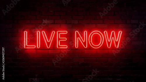 Vibrant red neon sign glowing with the words Live Now mounted on a dark brick wall. Concept of motivation and mindful living