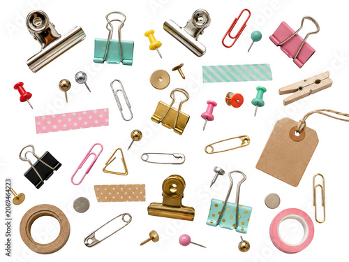 Assorted office stationery supplies including binder clips push pins and washi tape.