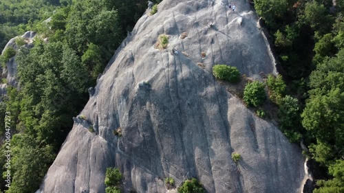 Aerial view of Sasso di Sant'Andrea, a prominent sandstone geological feature surrounded by dense forest. Zocca, Modena, Emilia-Romagna, Italy