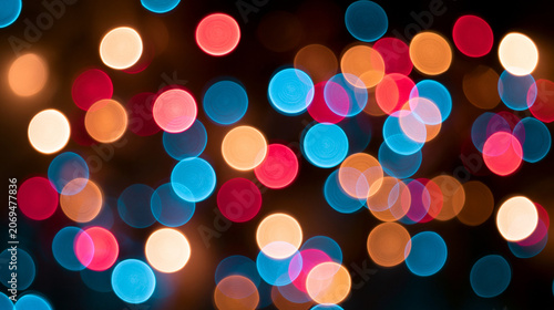 Colorful circular bokeh lights with blurred festive background