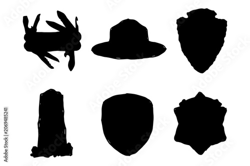 Set of black silhouettes of scouting and survival badges and tools on a white background.