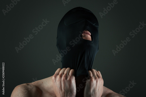 Fotografie Athletic man in boxers and a black mask covering his face