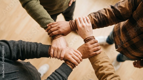 Friendship day concept diverse hands united in a circle of support and togetherness