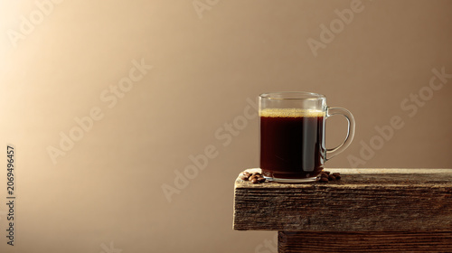 Black coffee on an old wooden table.
