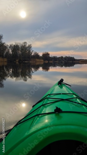 Kayaking on a Calm Lake at Sunset with Reflections