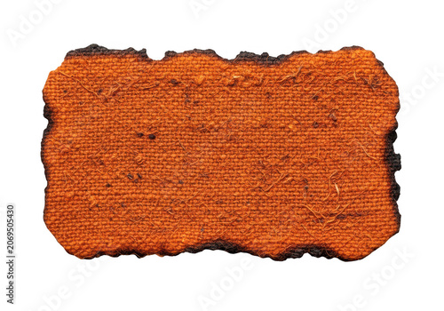 Rectangular piece of orange textured fabric with burnt edges isolated on transparent background for art