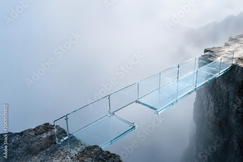 Transparent glass bridge between rocky cliffs. Space for text.