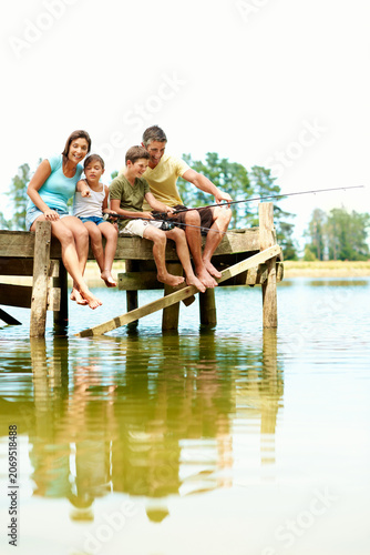 Fotografie Fishing, pier and family with children by lake for summer vacation, holiday and bonding in nature