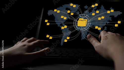 Photography Global Digital Connectivity and Networked Data Transfer Represented by File Icons on Computer Screen with Human Hand Reaching Out Fluxor