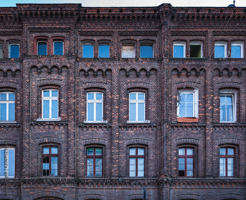 the front facade of derelict former factory buildings