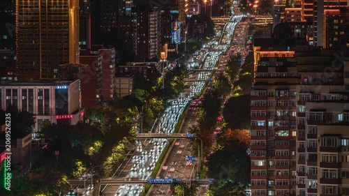Traffic flow patterns at the East Third Ring Road overpass in Beijing, urban night view, and urban development.