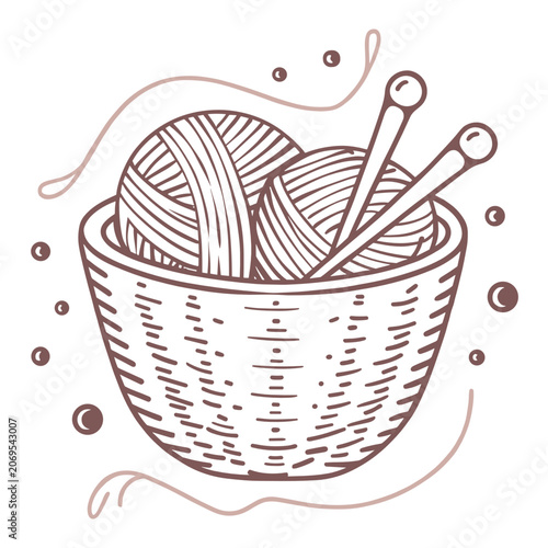 Knitting yarn balls and needles in a decorative basket  